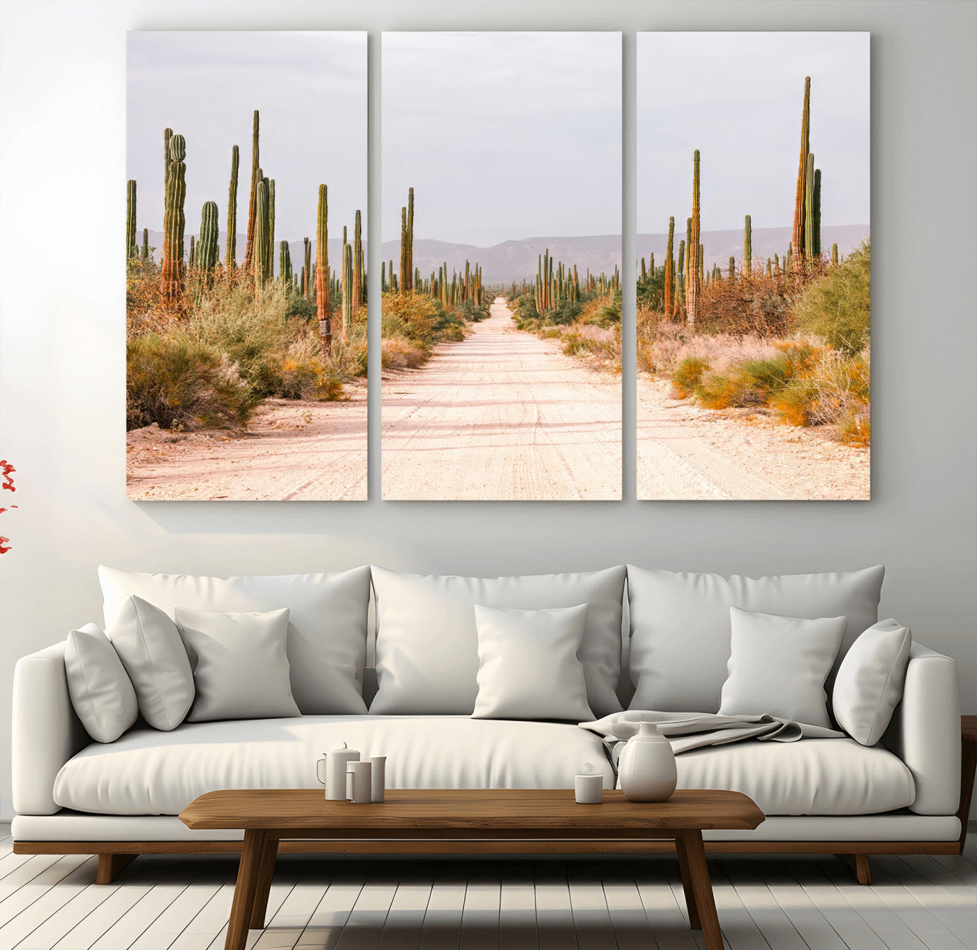 A desert road lined with saguaro cacti under a golden sky, creating a warm southwestern feel, perfect for boho or rustic decor.