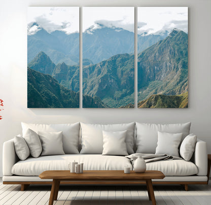 A misty mountain landscape with cloud-covered Andean peaks and lush green valleys, creating a dramatic and serene view, perfect for rustic or nature-inspired home decor.