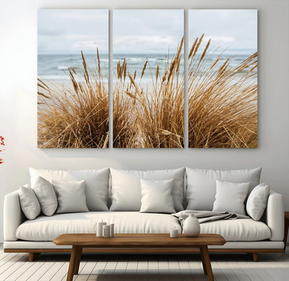 Canvas of golden beach grass swaying by the ocean under a soft cloudy sky, perfect for neutral-toned or coastal minimalist decor.