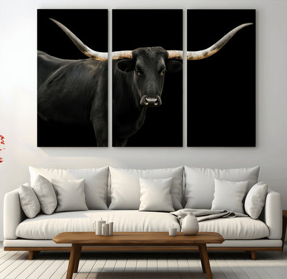 Close-up of a black Texas longhorn with large curved horns on black background, ideal for rustic farmhouse or modern western interiors.