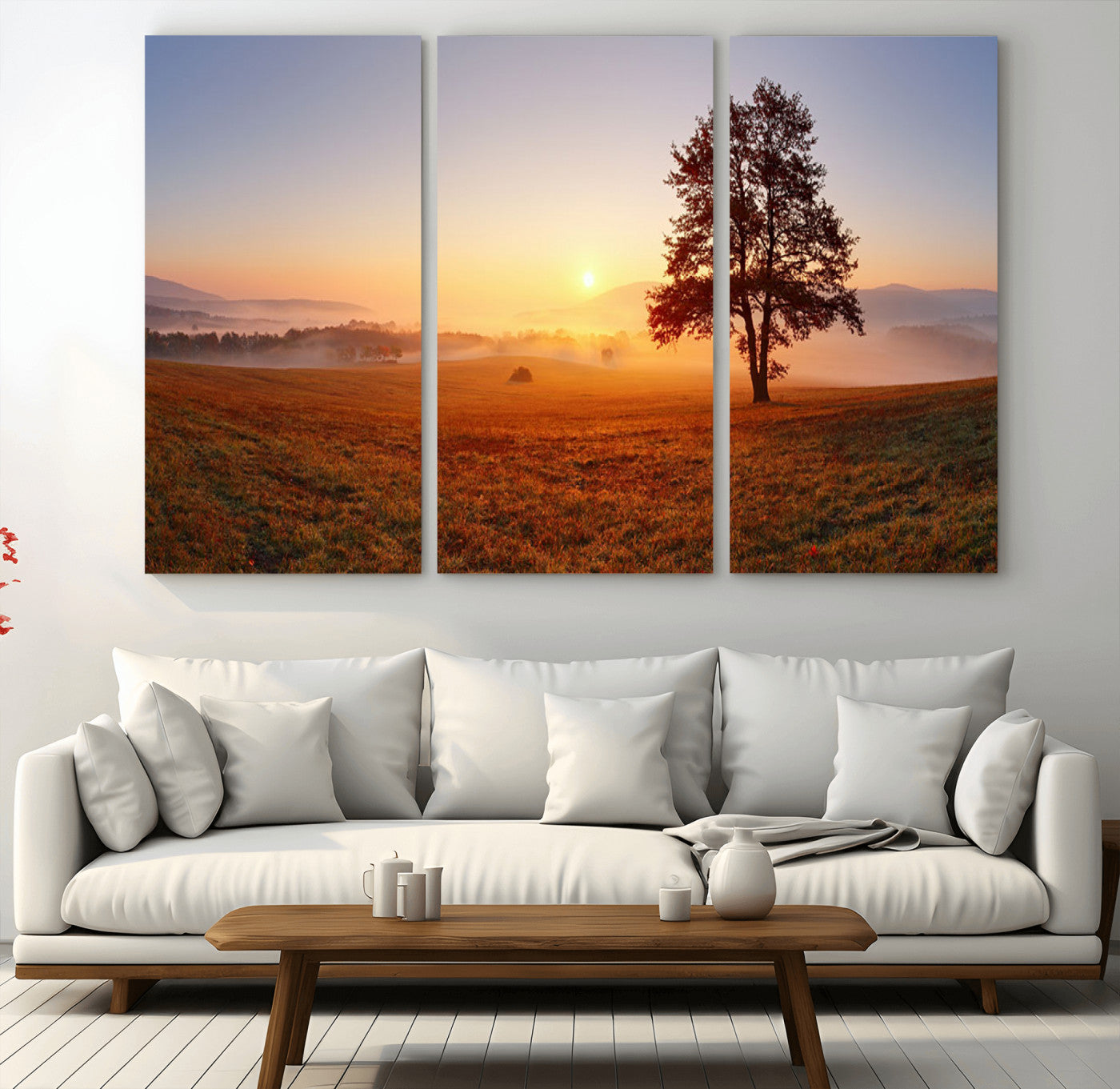 A tranquil landscape at sunrise with a mist-covered field and a lone tree, creating a peaceful and natural atmosphere.