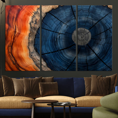 A captivating close-up of a tree trunk, showcasing its concentric rings in rich shades of blue, orange, and brown, highlighting the organic patterns of natural wood.