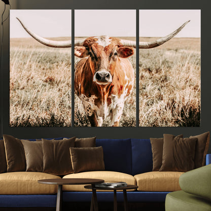 Framed longhorn cow canvas wall art with rustic prairie background, western animal print perfect for farmhouse or ranch style decor