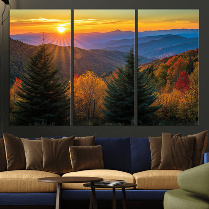 Vibrant sunset over autumn mountains with colorful trees and warm light, ideal for nature lovers or cabin-style wall decor.