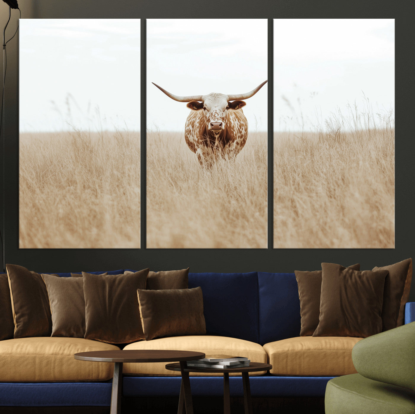 Texas Longhorn bull standing alone in dry grass with neutral tones, ideal for rustic western or cowboy-themed wall decor.