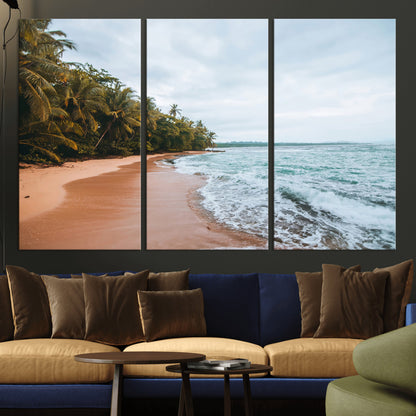 Framed canvas of a tropical beach with palm trees and soft waves, ideal for coastal escape or serene nature-inspired home decor.
