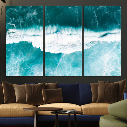 Aerial view of turquoise ocean waves crashing with white foam, perfect for tropical coastal or modern beach-style home decor.