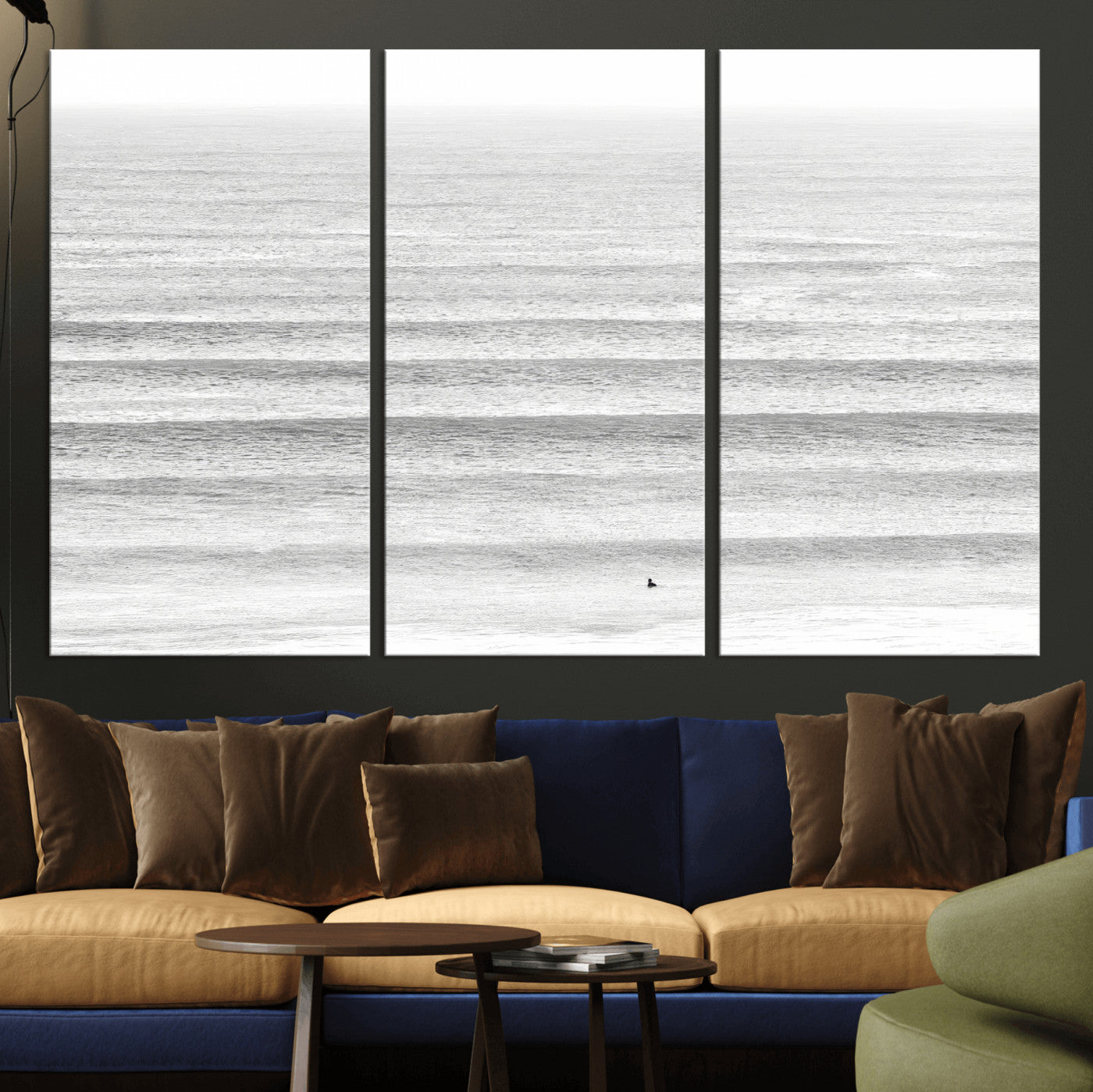 Monochrome photo of a lone surfer in calm layered waves, perfect for minimalist coastal or moody ocean-inspired wall decoration.