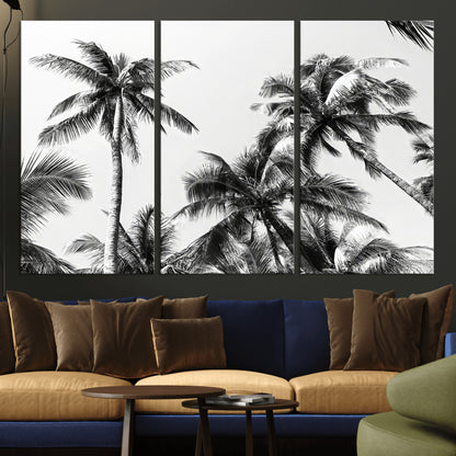Black and white canvas of tall palm trees in moody tones, perfect for modern tropical minimalist or coastal-style home decor.