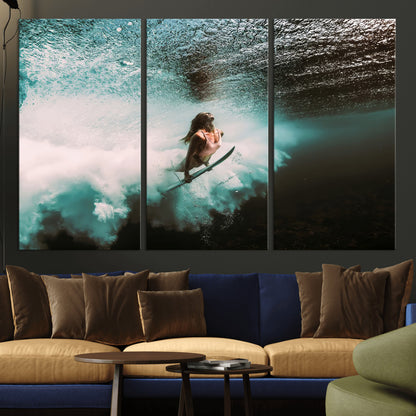 Vibrant underwater photo of a female surfer diving through turquoise waves, perfect for coastal boho or surf-inspired home decor.