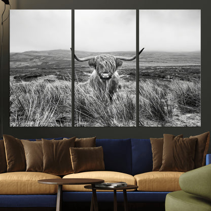 A black and white portrait of a Highland cow in a foggy Scottish countryside, capturing a rustic aesthetic and tranquil farm escape.