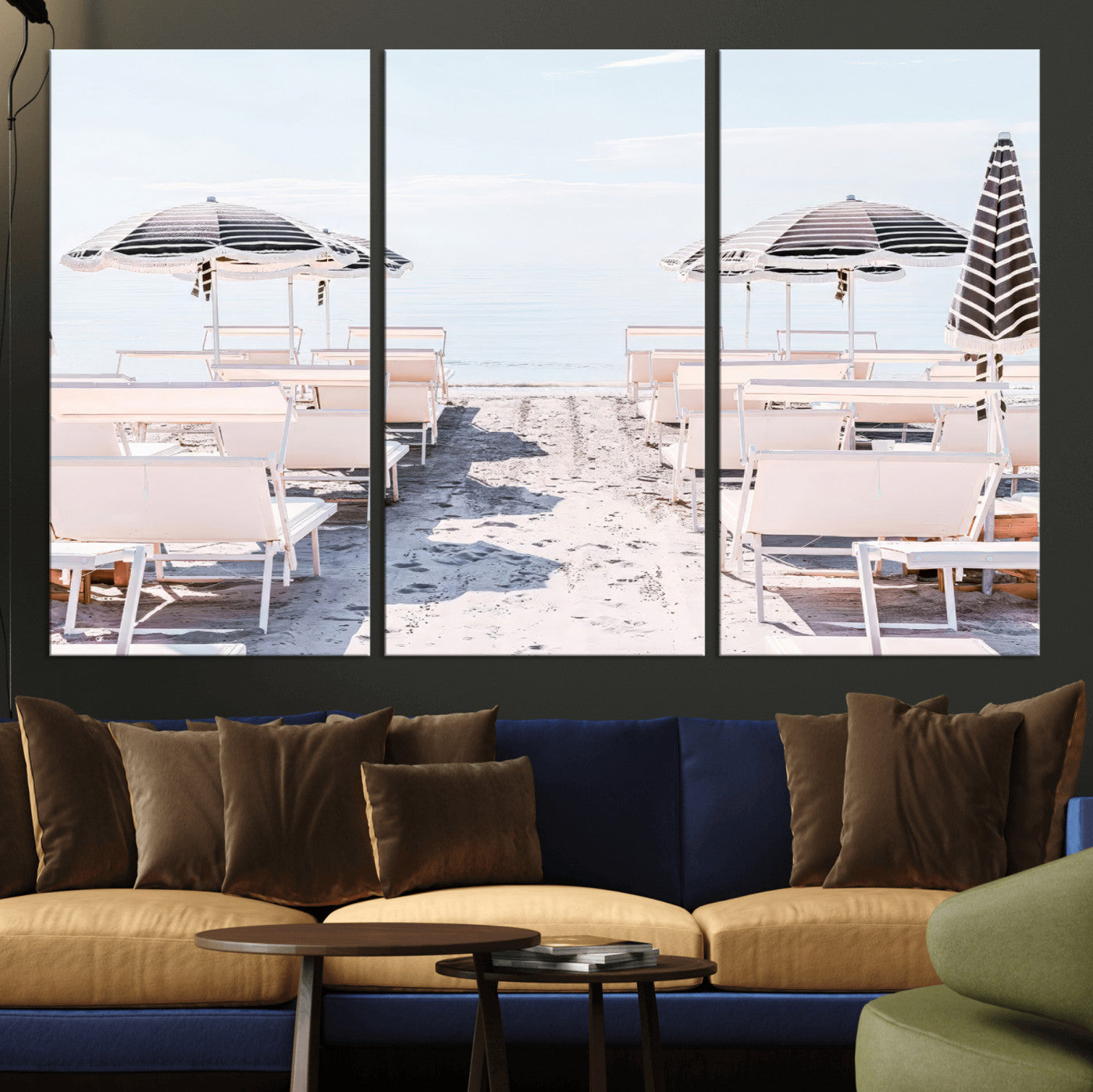 A serene minimalist beach scene featuring striped umbrellas, soft pastel sand, and an elegant lounge setup, creating a tranquil and stylish coastal retreat.