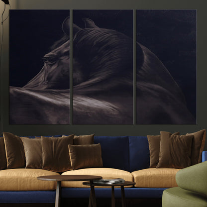 Close-up of a black horse with dramatic lighting on a dark background, perfect for rustic or masculine home decor.