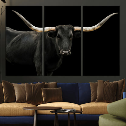 Close-up of a black Texas longhorn with large curved horns on black background, ideal for rustic farmhouse or modern western interiors.