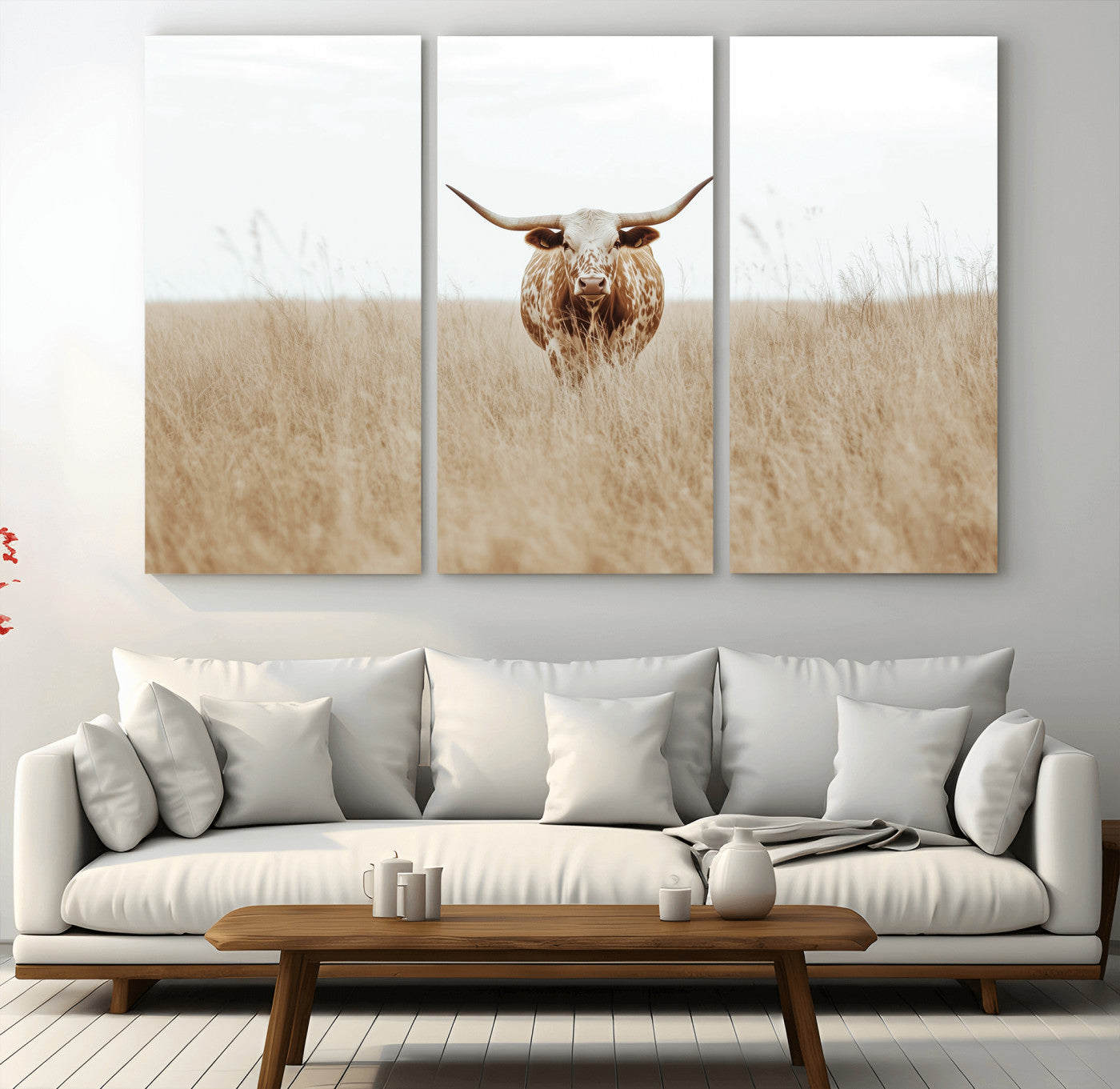 Texas Longhorn bull standing alone in dry grass with neutral tones, ideal for rustic western or cowboy-themed wall decor.