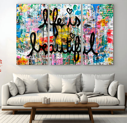 Colorful urban-style canvas with graffiti text “Life is Beautiful” in black paint, ideal for bold or street-themed home decor.