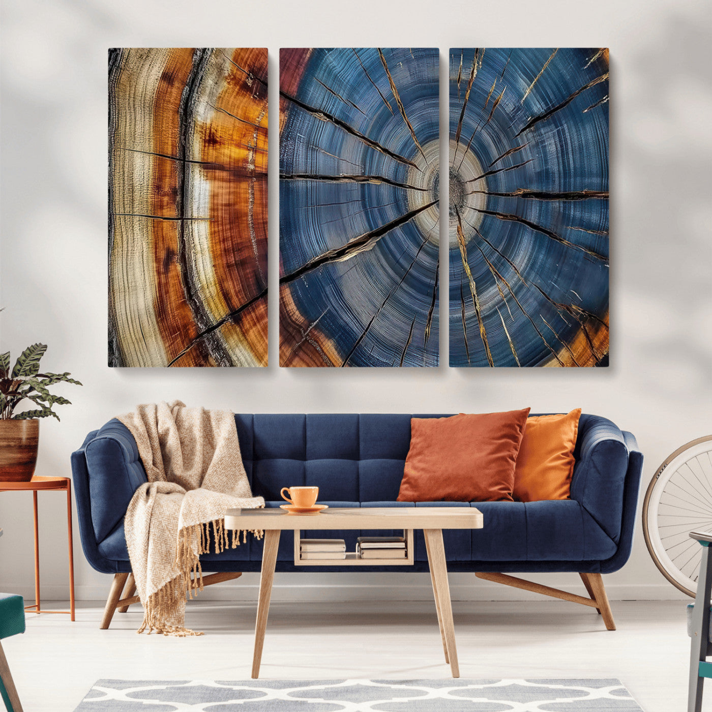 A stunning close-up view of a tree trunk, showcasing the intricate growth rings in a vibrant mix of warm browns, cool blues, and hints of natural texture.