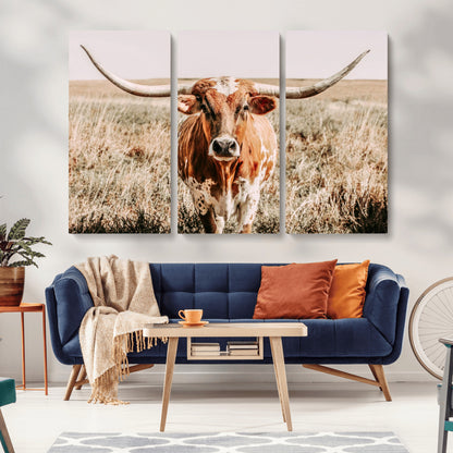 Framed longhorn cow canvas wall art with rustic prairie background, western animal print perfect for farmhouse or ranch style decor