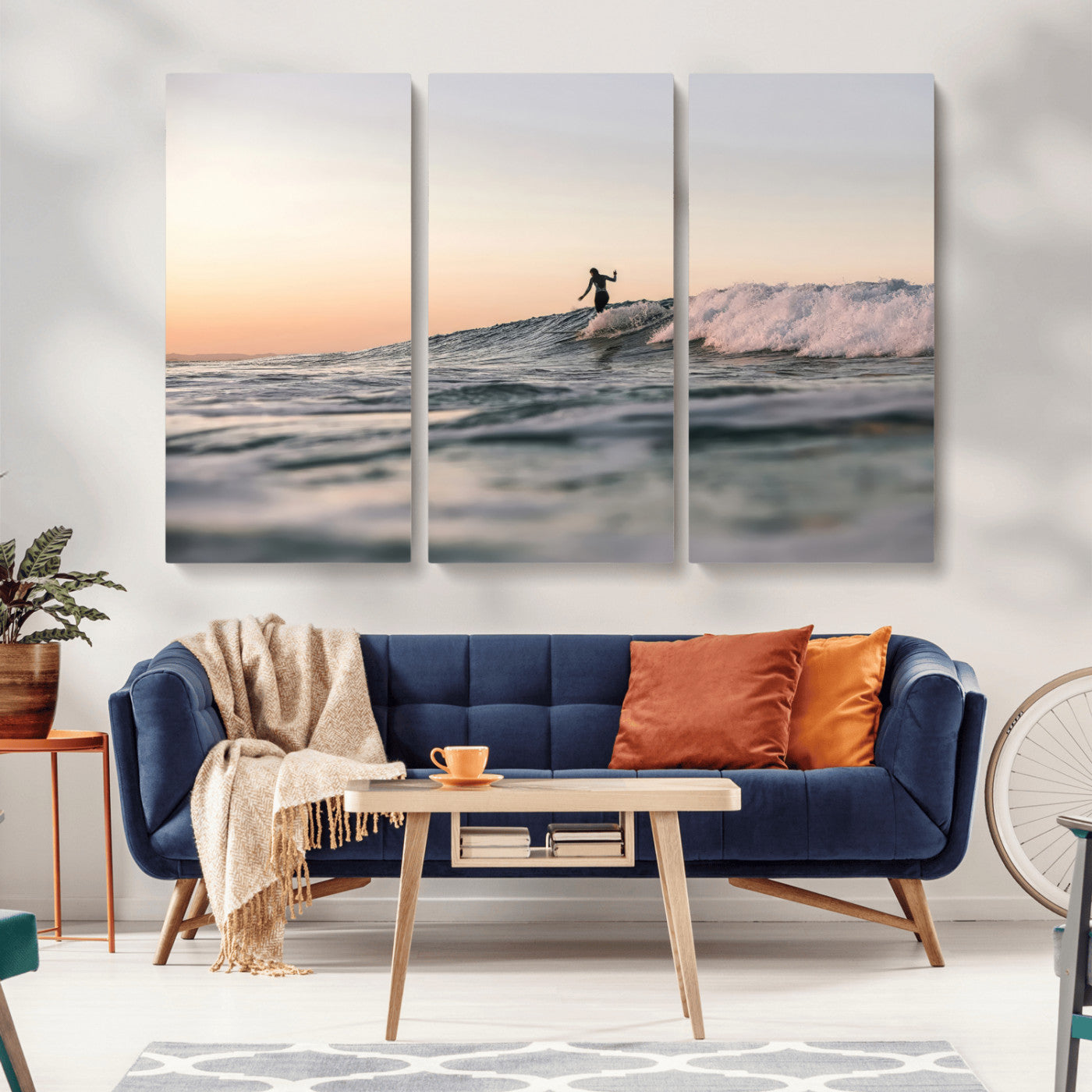 Framed canvas of a female surfer balancing on a wave at sunset, perfect for serene surf or ocean-inspired coastal decor.