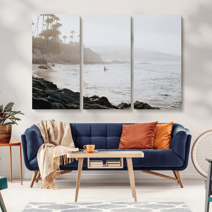 Framed canvas of a surfer in misty coastal tones at a foggy California beach, ideal for minimalist coastal beach or serene ocean-themed decor.