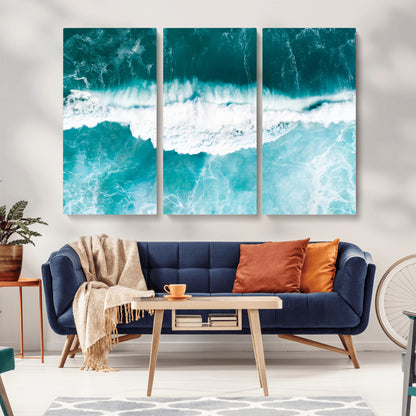 Aerial view of turquoise ocean waves crashing with white foam, perfect for tropical coastal or modern beach-style home decor.