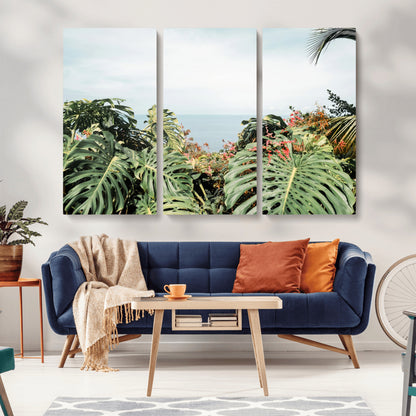 Monstera leaves and tropical flowers framing a calm ocean view, ideal for tropical coastal or exotic jungle-style interior wall decor.