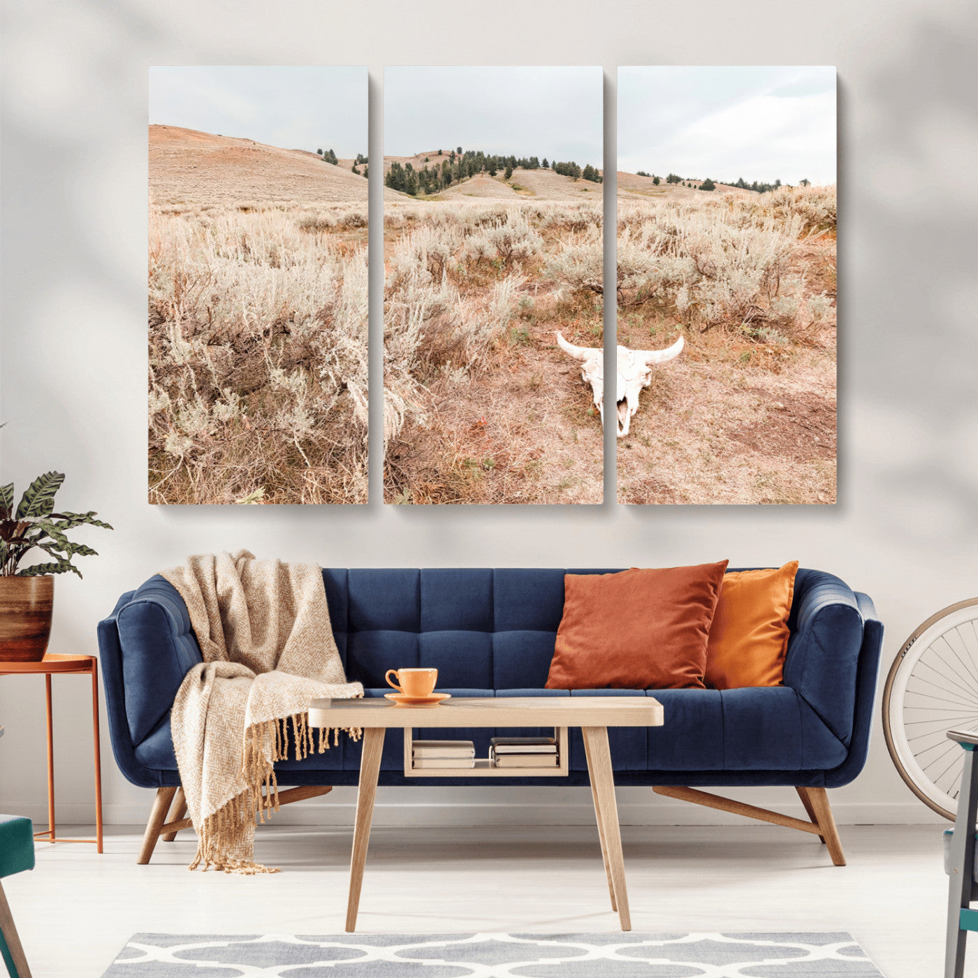 Rustic bull skull on dry sagebrush field under soft light, ideal for western minimal or desert prairie-style wall decoration.