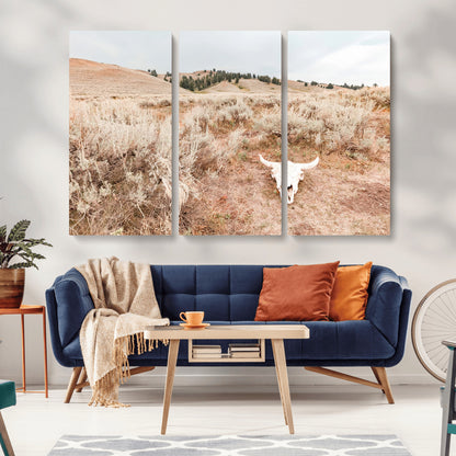 Rustic bull skull on dry sagebrush field under soft light, ideal for western minimal or desert prairie-style wall decoration.