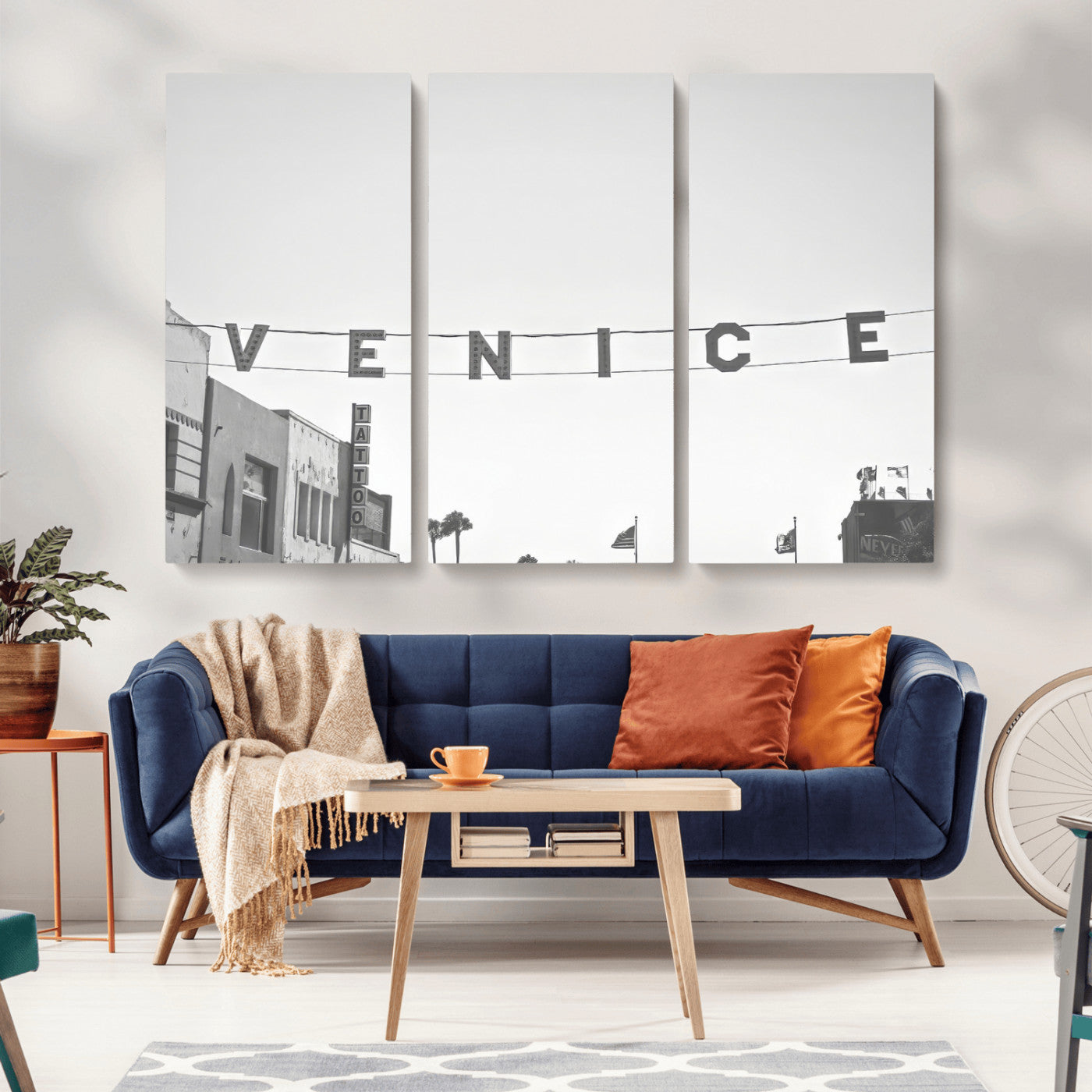 Black and white photo of Venice Beach sign and palm-lined street, perfect for urban coastal or minimalist LA-inspired wall decoration.