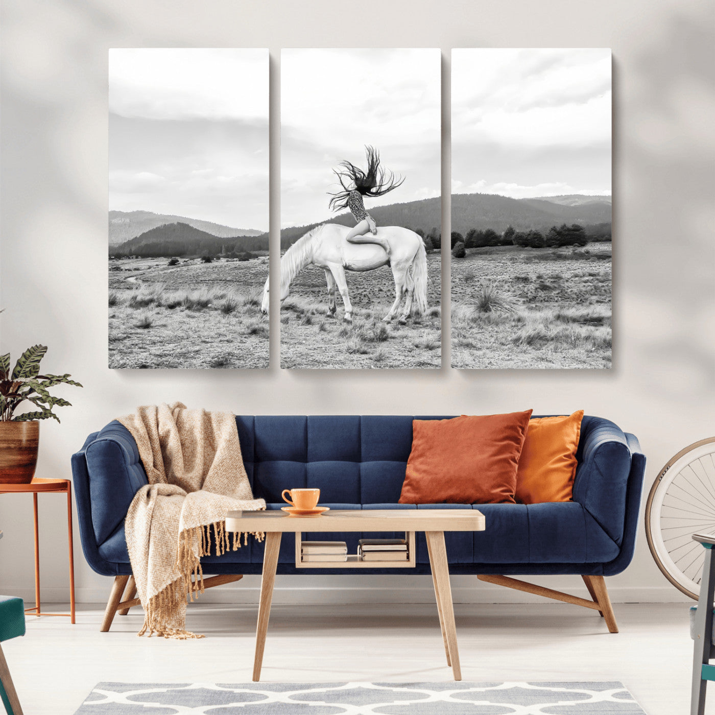 Black and white photo of a woman on a white horse in moody tones, ideal for Western Boho or modern rustic-style home decor.