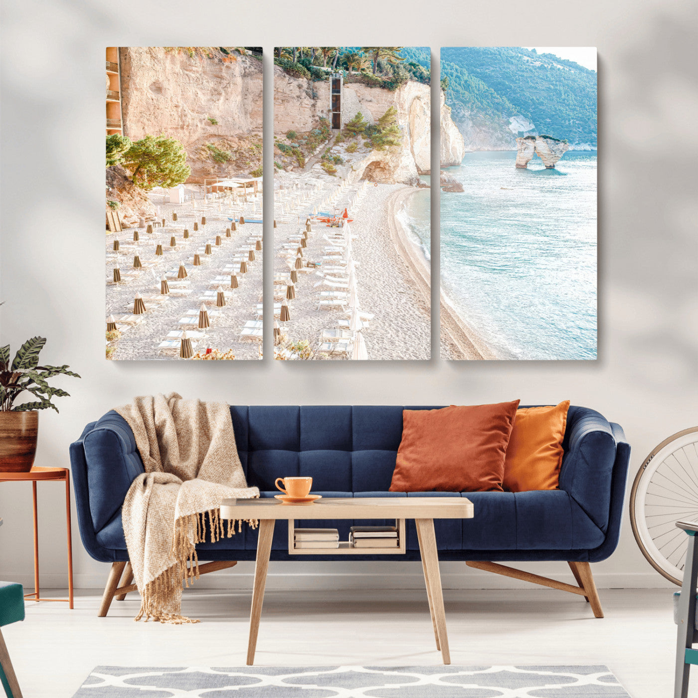 Wall art of a calm Mediterranean beach with rows of sun loungers and umbrellas in soft pastel tones, perfect for light coastal or vacation-themed decor.