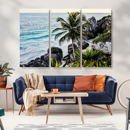 Framed canvas of a vibrant tropical coastline with palm trees, rocky cliffs, and turquoise waters, ideal for tropical coastal home decor.