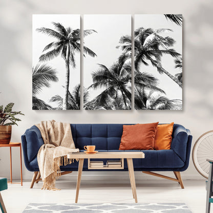 Black and white canvas of tall palm trees in moody tones, perfect for modern tropical minimalist or coastal-style home decor.