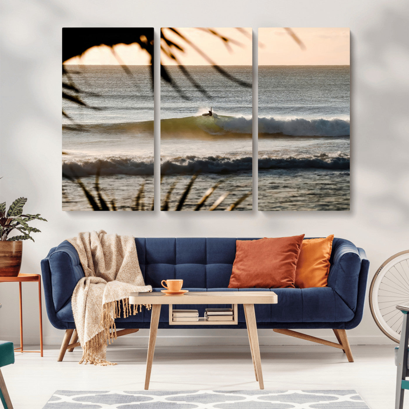 Photo of a surfer riding a golden hour wave at sunset, with tropical tones and dreamy light, perfect for tropical boho or coastal home decor.
