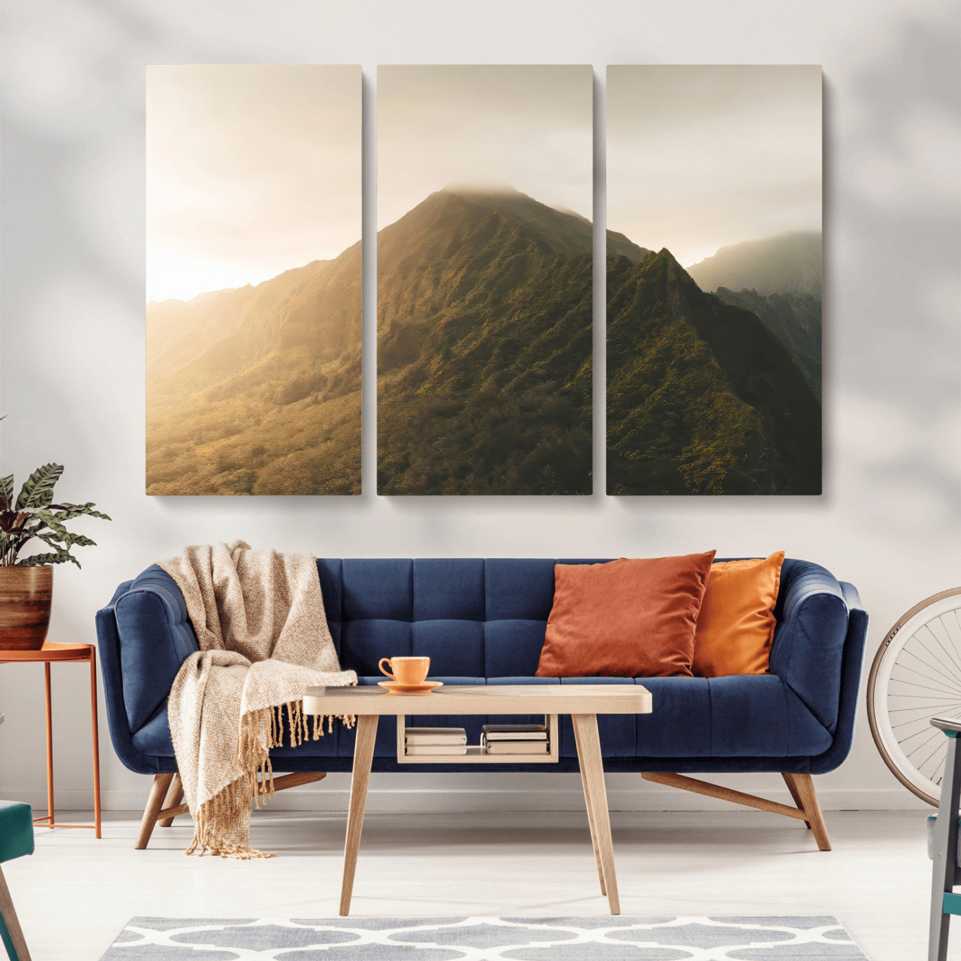 Sunlit mountain peak with mist rolling over its rugged slopes, bathed in golden light, creating a warm and tranquil nature-inspired scene.