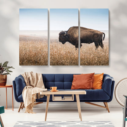 A majestic bison standing in an open prairie field, its strong form blending into the golden grass under a vast blue sky, evoking the wild spirit of the American plains.