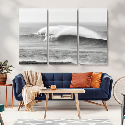 A dramatic black and white ocean wave crashing with immense force, capturing the raw power and movement of the sea in a bold seascape.