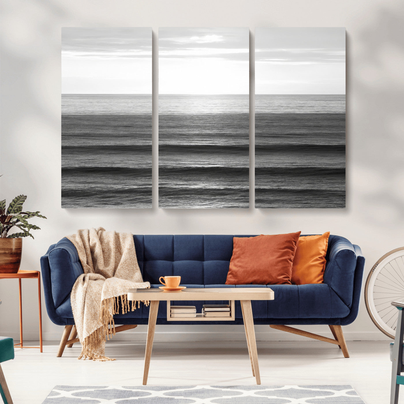 Minimalist black and white ocean view with layered waves reflecting sunlight, evoking a sense of calm and coastal serenity.