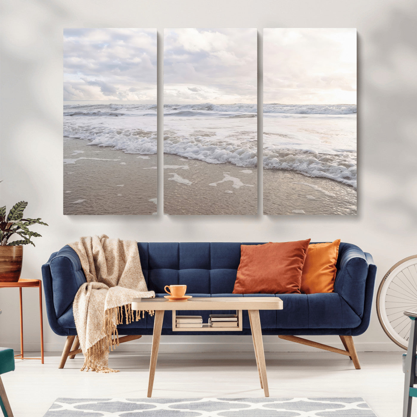 Peaceful ocean waves rolling onto the sandy shore under soft light, perfect for neutral or coastal minimalist decor themes.