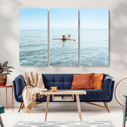 A peaceful minimalist scene of a person floating on crystal-clear water, surrounded by a vast open horizon, capturing relaxation and serenity in a tranquil aquatic setting.