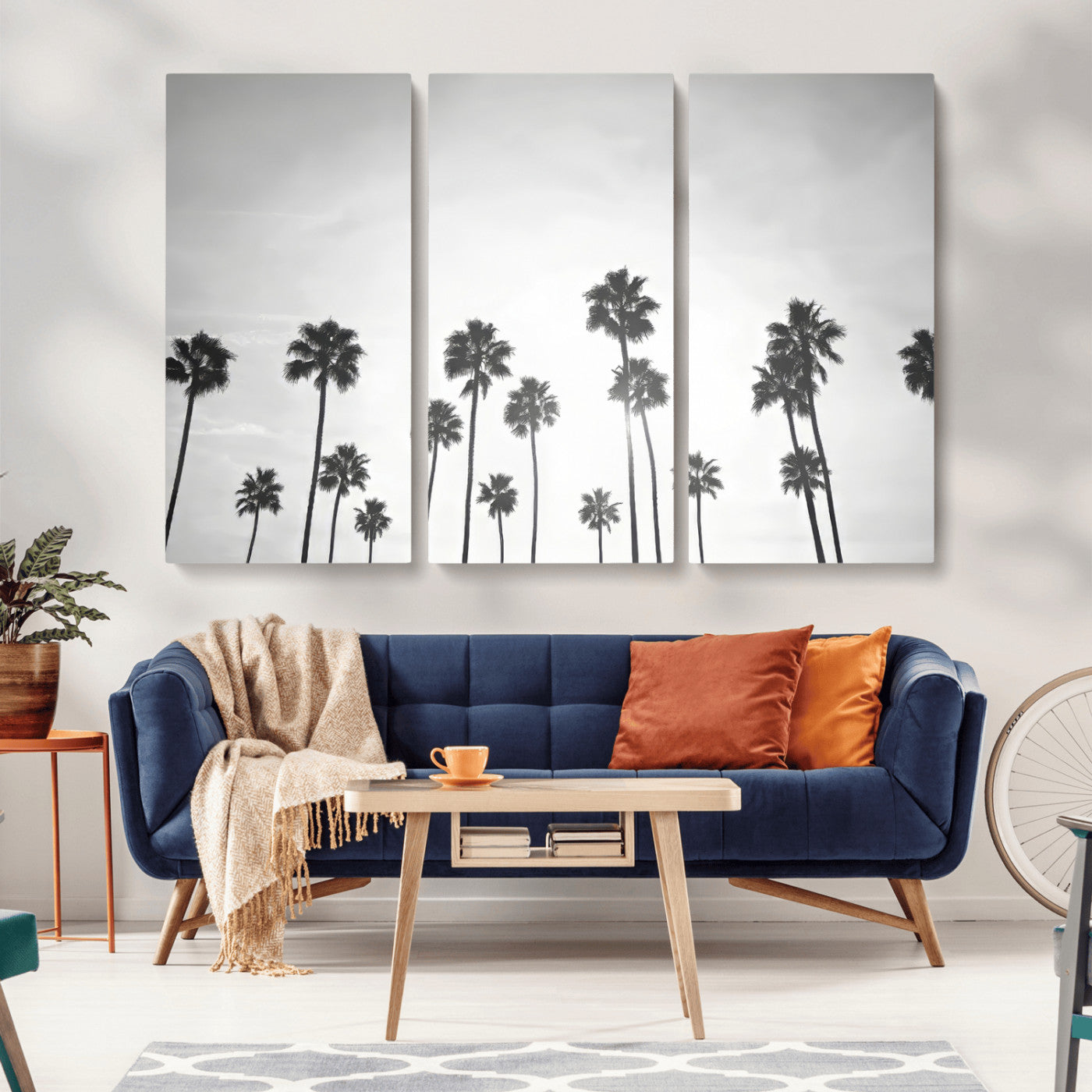 A black and white minimalist scene featuring tall palm trees silhouetted against a bright sky, creating a dreamy and timeless tropical aesthetic.