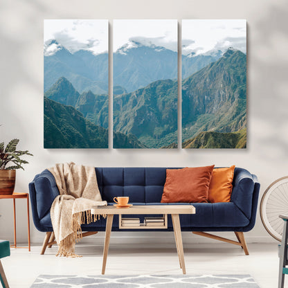 A misty mountain landscape with cloud-covered Andean peaks and lush green valleys, creating a dramatic and serene view, perfect for rustic or nature-inspired home decor.