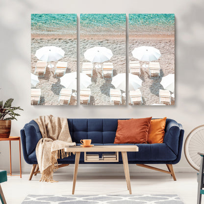 A bright beach scene with white umbrellas, pastel sand, and turquoise waters, creating a tranquil coastal vibe, perfect for beach house or summer decor.