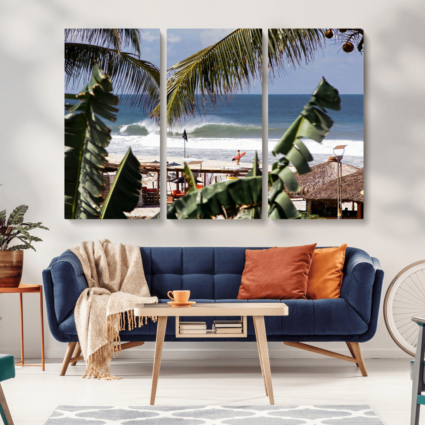 Canvas wall art of a tropical surf scene framed by palm trees, with a surfer on the shore and waves rolling in, ideal for beach-themed decor.