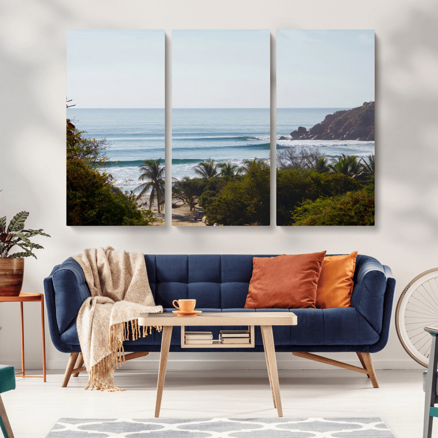 View of calm ocean waves with palm trees and a tropical coastline, ideal for coastal boho or beach-themed wall decor.