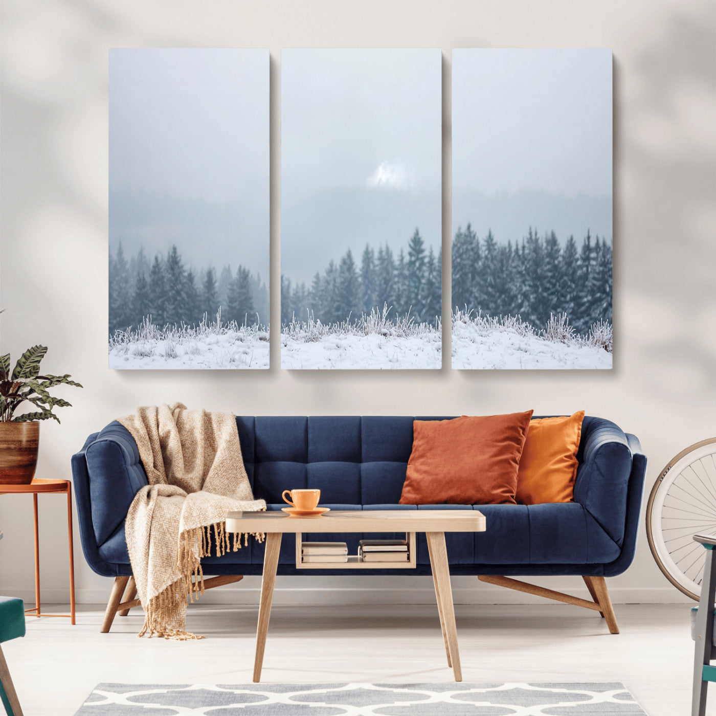 Snow-covered forest under misty sky, soft light breaking through clouds, ideal for minimalist or Nordic-inspired home decor.