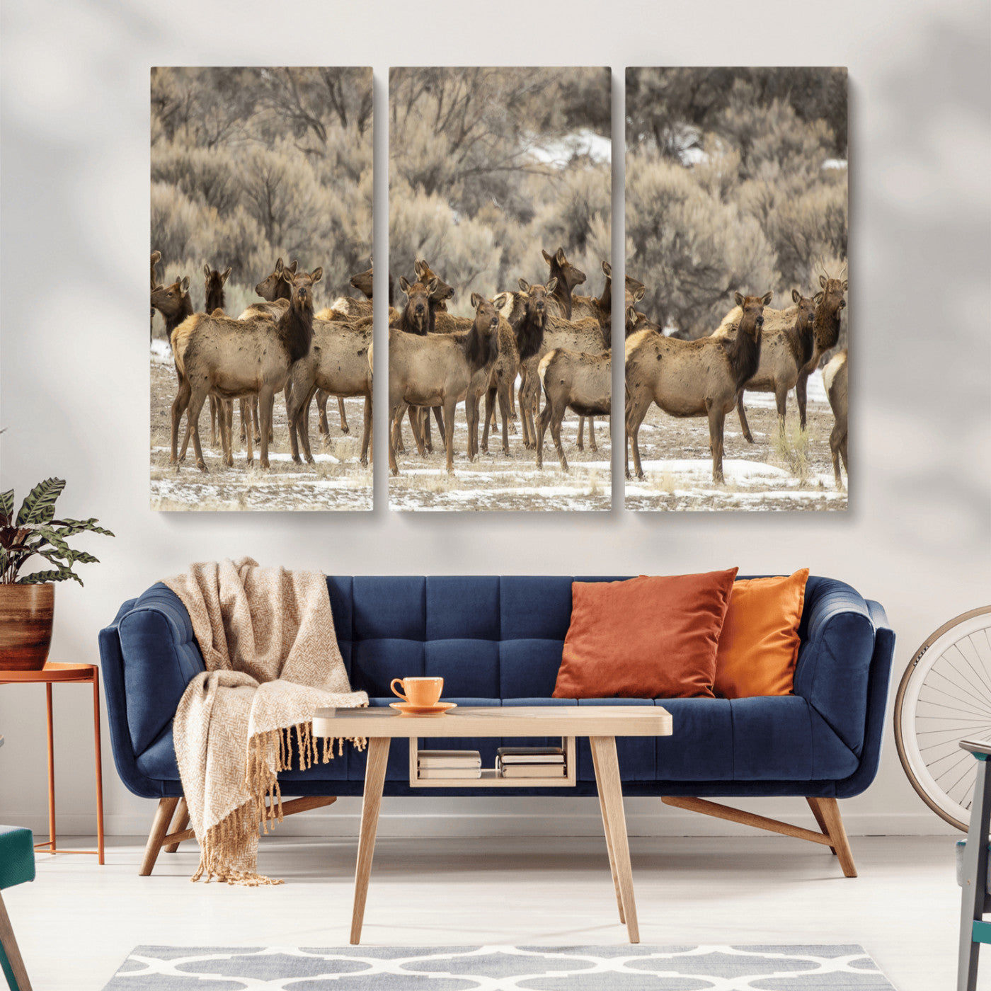 A large herd of elk standing in an open field with soft earthy tones, ideal for rustic lodge or western-themed home wall decor.