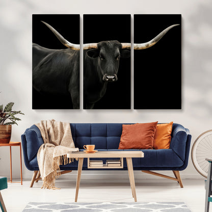 Close-up of a black Texas longhorn with large curved horns on black background, ideal for rustic farmhouse or modern western interiors.