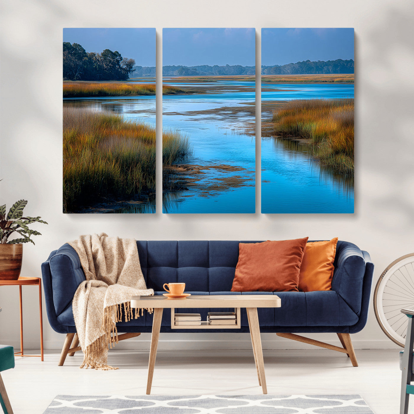 A peaceful marshland scene with calm blue water reflecting the surrounding grasses and trees, capturing the beauty of nature in a serene landscape.