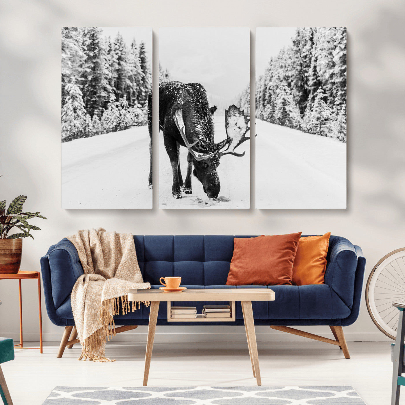 A majestic moose grazing in the snow-covered wilderness, surrounded by snow-covered trees, creating a peaceful winter scene.